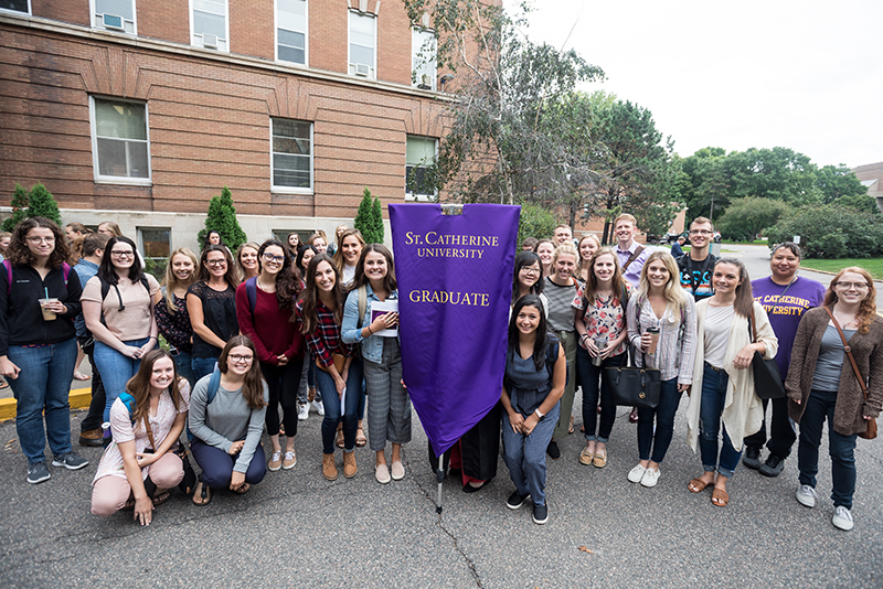 Large group of graduate students gathers at opening celebration