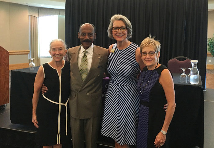 School of Social Work Dean Barbara Shank, keynote speaker Dr. Larry E. Davis, St. Catherine University President ReBecca Koenig Roloff '76 and University of St. Thomas President Julie Sullivan.