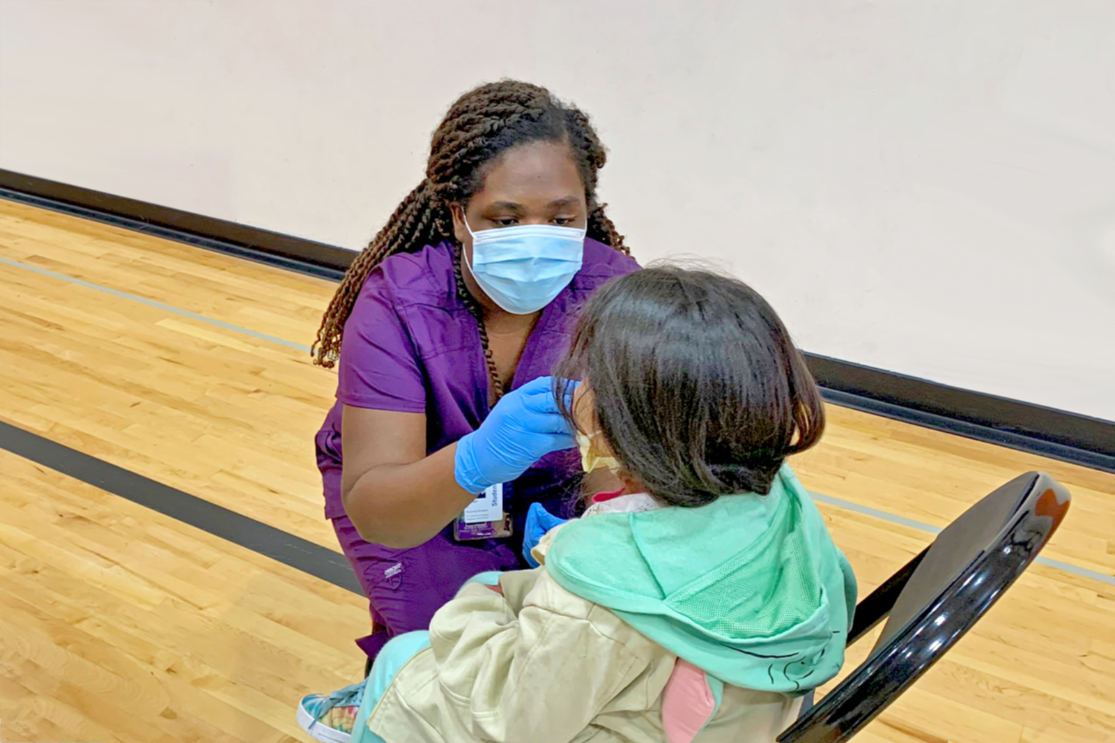 Katilyn Taylor, MSN-EL’22, Administers Flu Vaccine To An Elementary School Student During Her Clinical Work At The Bear Care Health And Wellness Clinic In The White Bear Lake School District.