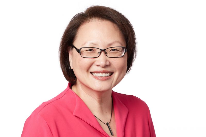 Headshot photo of Minda Suchan on a white background.