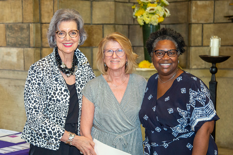 Holly Clynch (center) stands for recognition with President Roloff and Provost Thomas.