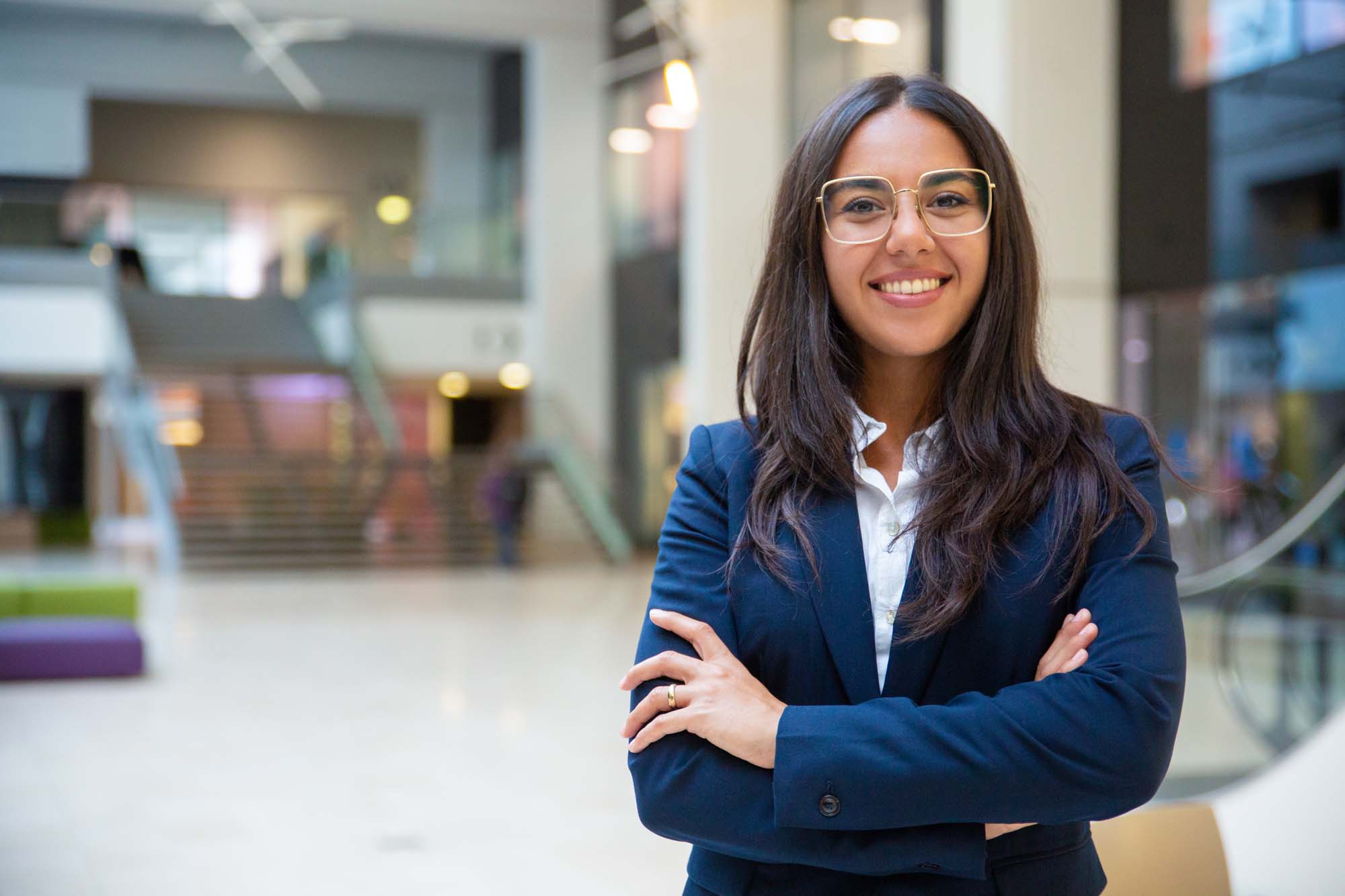 A Healthcare Management graduate, smiling and looking confident