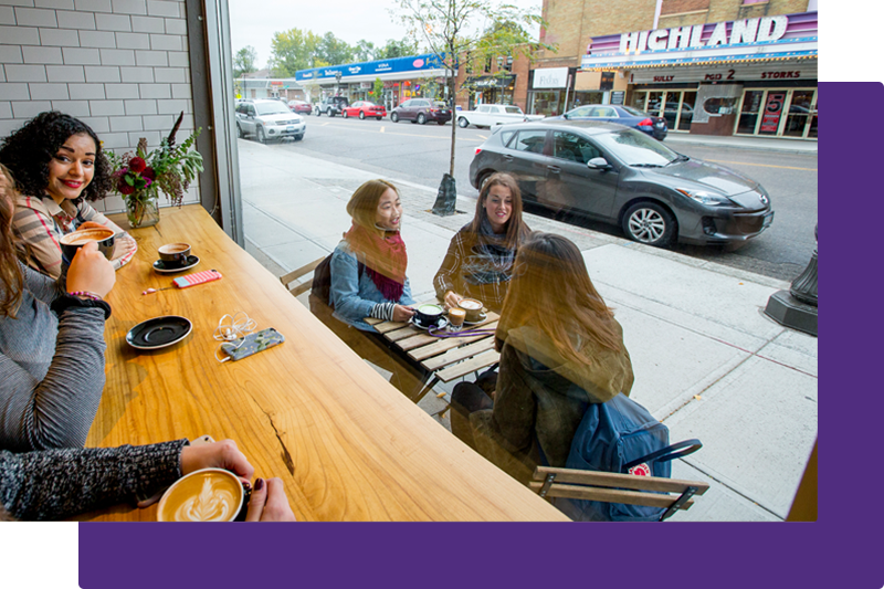 students visiting in neighborhood coffee shop