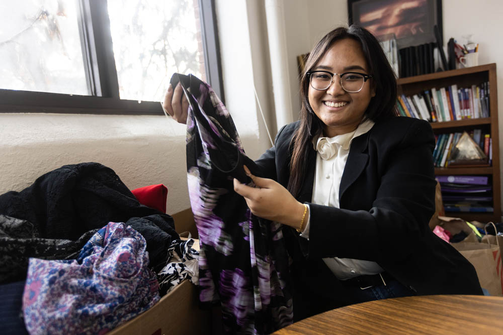 FM_hero Student examining basket of clothes