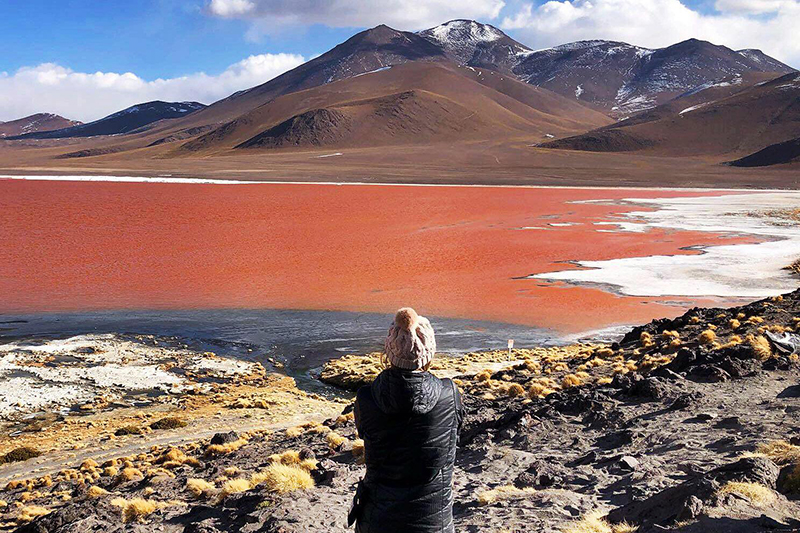Abroad student looking over mountain and plaines of Bolivia