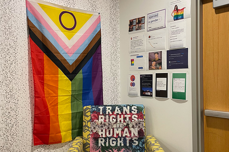Corner of the Queer Resource center with a sign that reads "Trans rights are human rights"