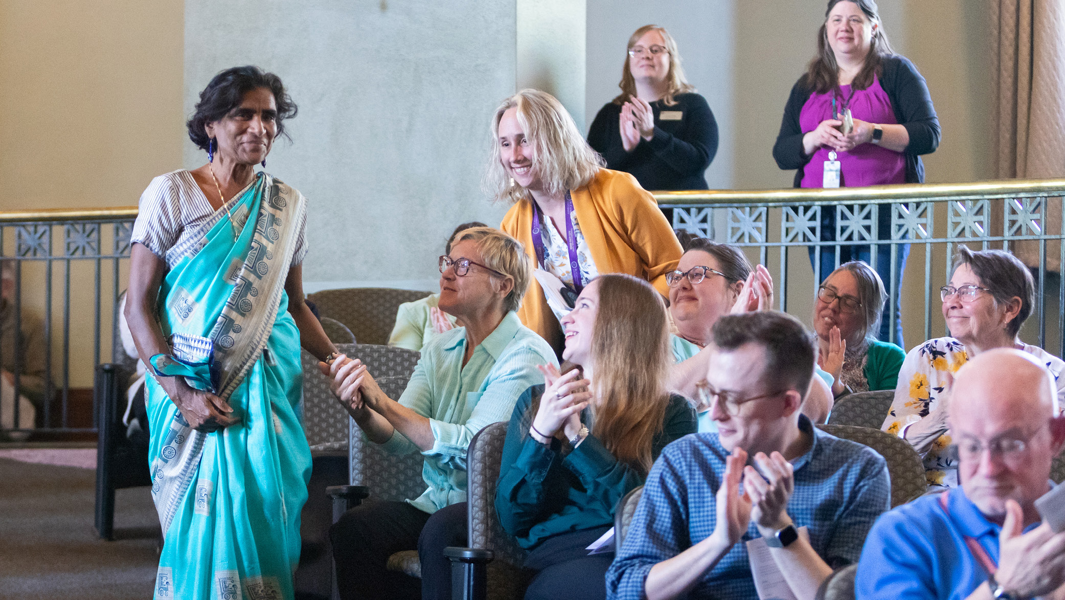 The audience applauds for a winner at the Faculty and Staff Recognition Ceremony.