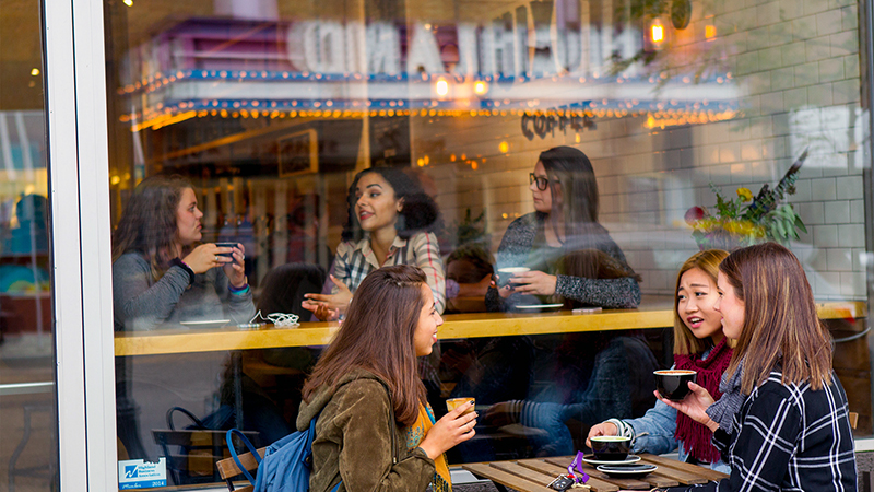 students visiting in local coffee shop