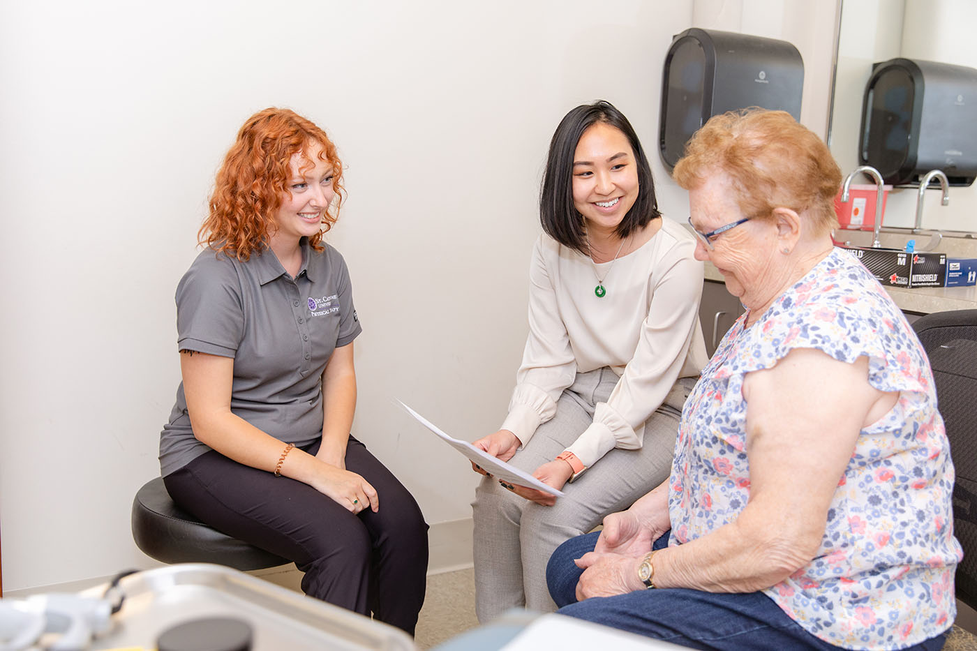 Nurse practitioner seeing older patient.