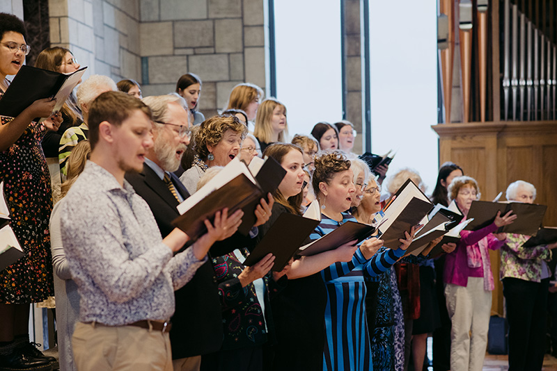 Closeup of pickup choir members singing a song