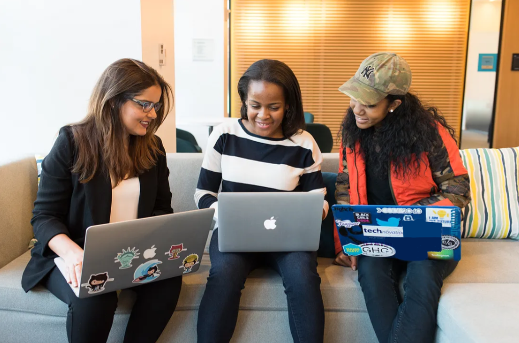 women working on a computer together