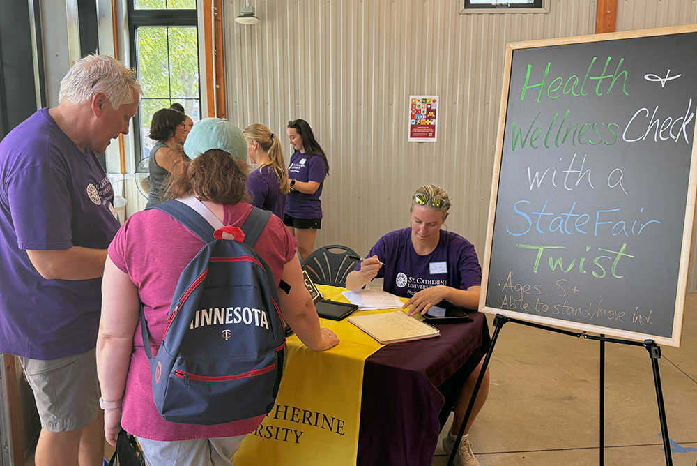 St. Kate's Exhibitors talking to fair-goers at Minnesota State Fair