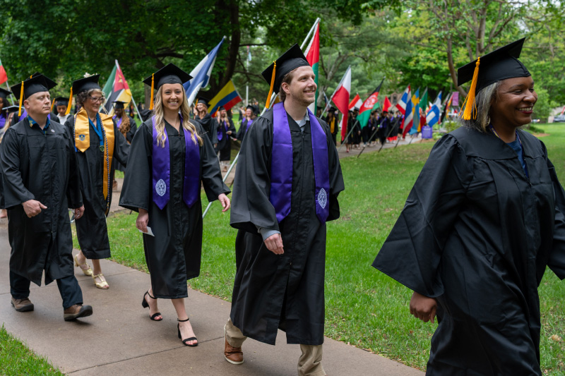 College for Adult graduates walking procession