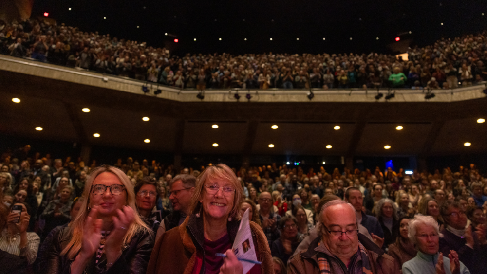 audience members inside the house waiting for the show