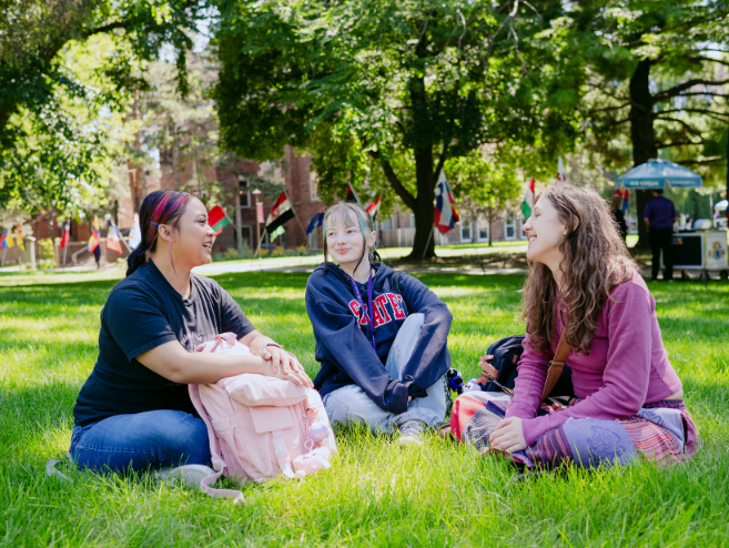 Students chat on the quad lawn