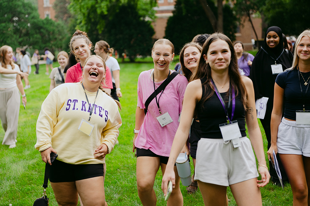 students walking and laughing on campus