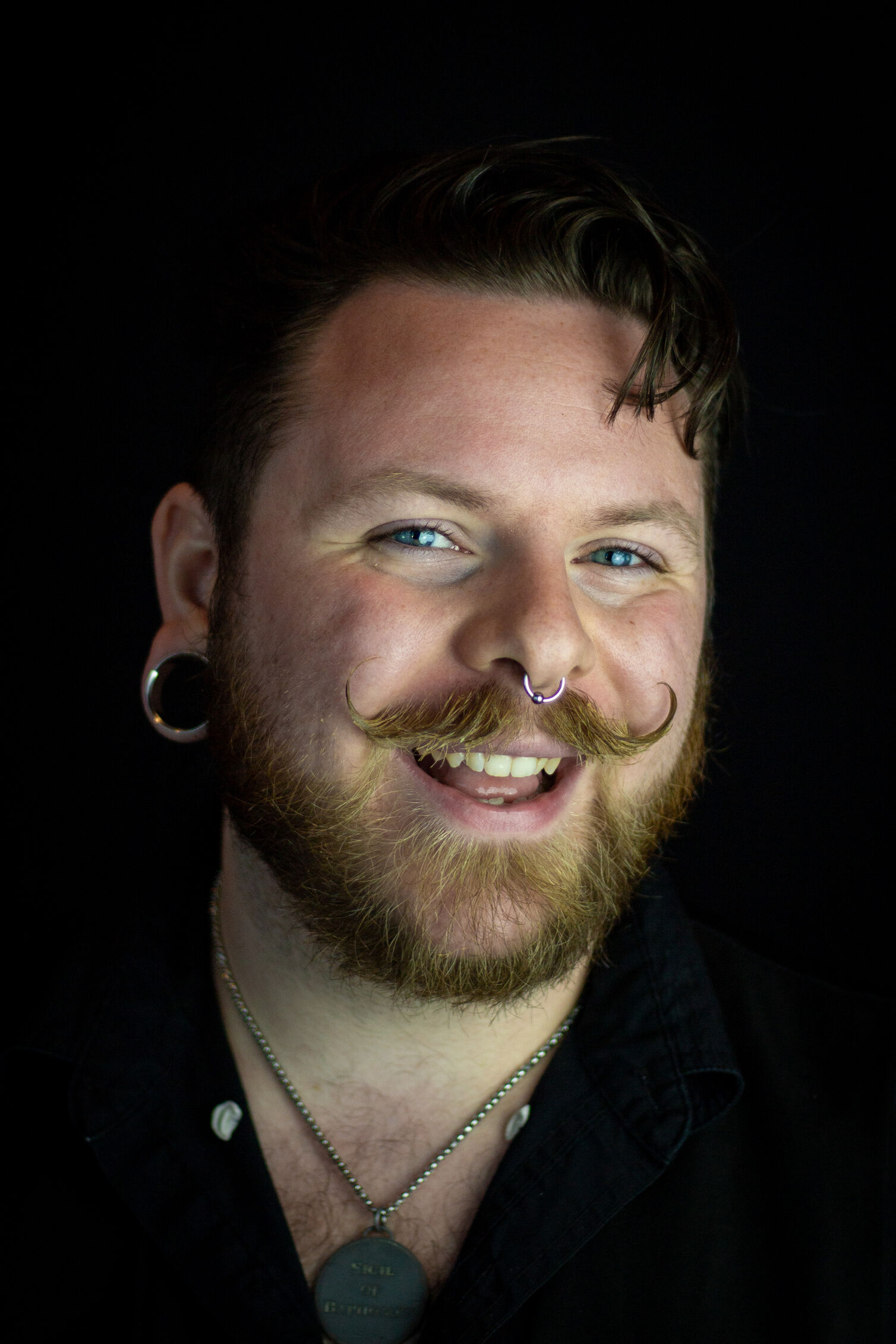 Headshot of a smiling man
