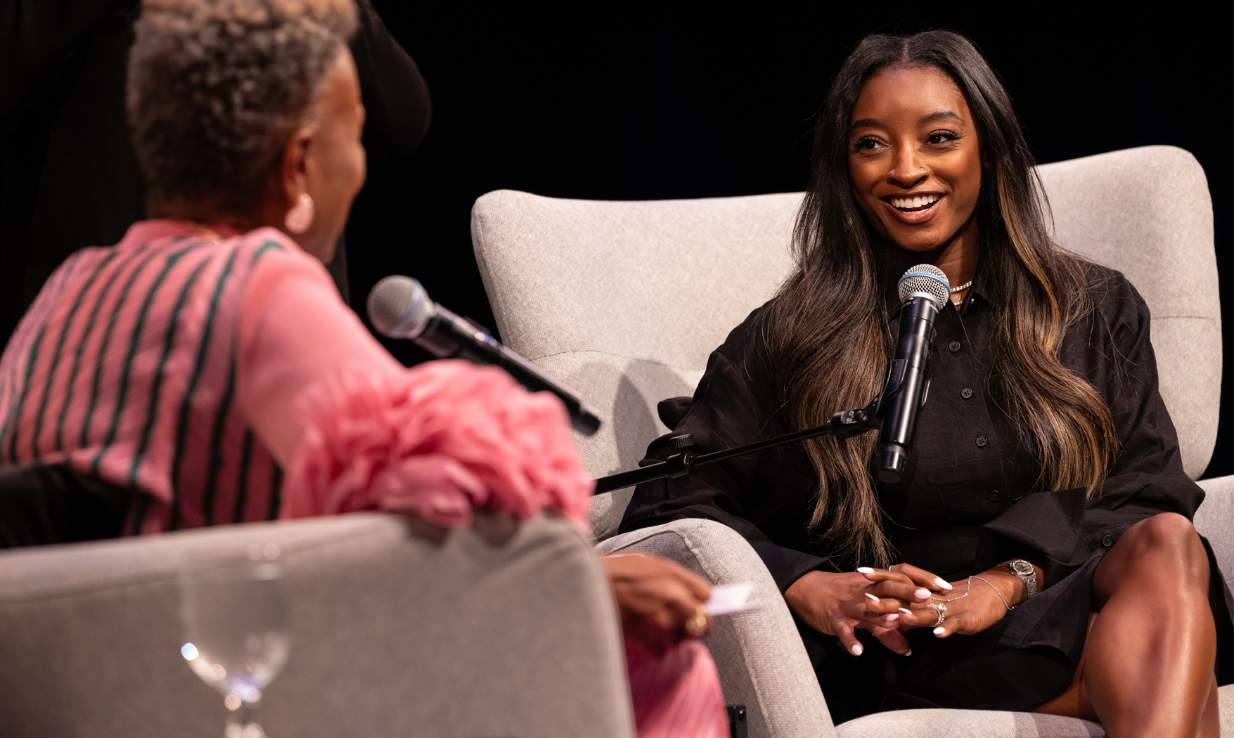 Simone Biles speaks on stage at The O'Shaughnessy.