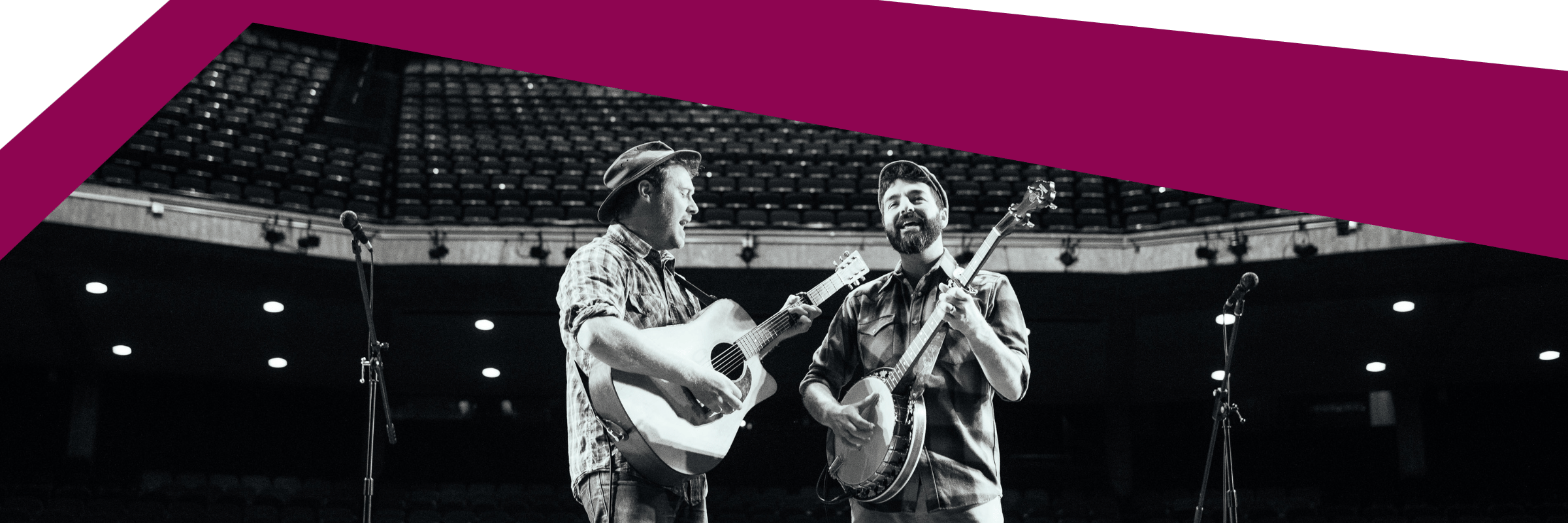 two musicians with their string instruments on stage