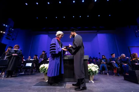 President Roloff and graduate