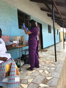 St. Kate's student preparing vaccination
