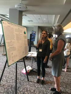 Sydney Schumann with President Roloff