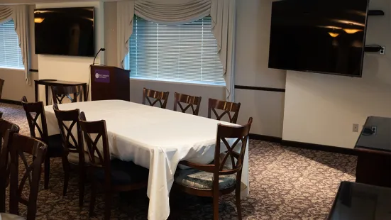 President's Dining Room showing tv screens and podium