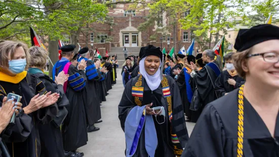 Staff and faculty cheer for graduate procession 