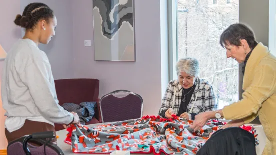 Women making blankets