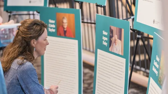 Woman reading poster