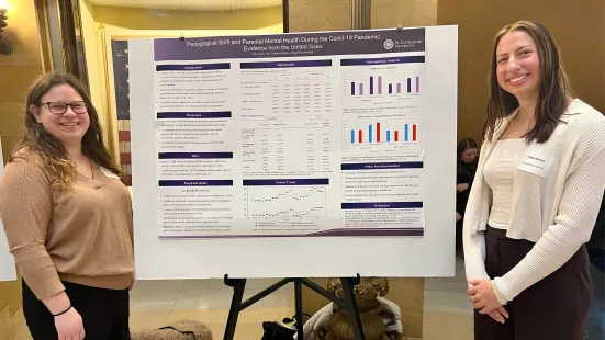 Student researchers with their presentation poster