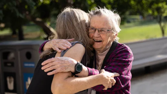 Alumni grin and hug at Reunion