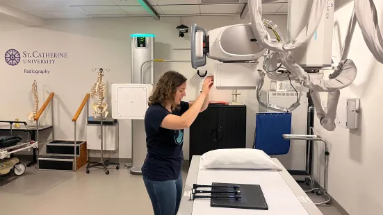 Katie positions the bagpipe chanters in the radiography lab. 