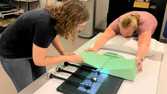 Katie Brady and instructor Kari Fleming position bagpipe chanters in the radiography lab.