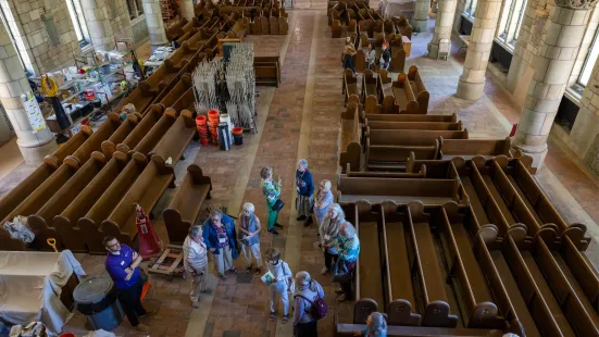 A near bird's eye-view of people getting a tour of the inside of the Chapel.
