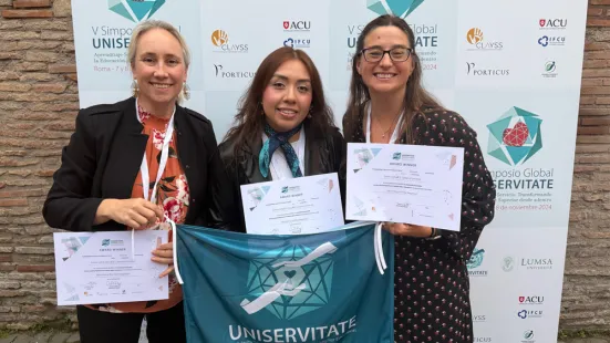 Kristine West, PhD; Victoria Delgado-Palma ’23; and D'Ann Urbaniak Lesch with Uniservitate certificate