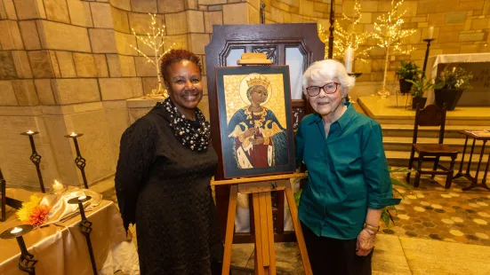 President Evans and Kathleen Holmberg, CSJ, ’60 with Holmberg's painting of Saint Catherine