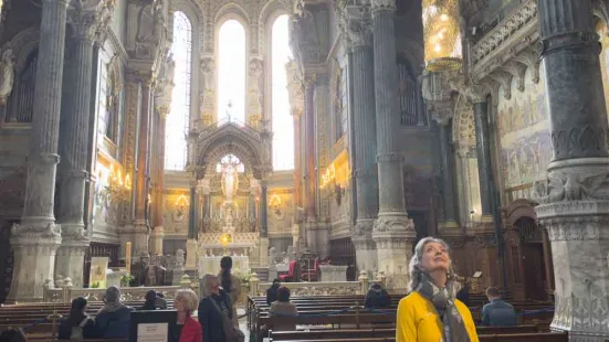 The inside view of a cathedral. In the foreground is Becky Roloff looking up at the ceiling.