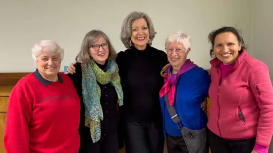 Alumna and Becky Roloff pictured standing together.