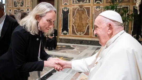 Kristine West, PhD, shakes the hand of His Holiness Pope Francis