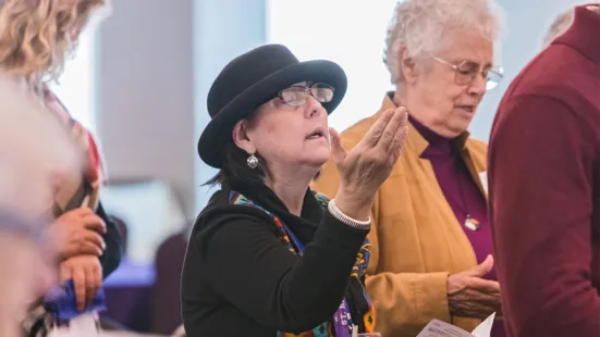 Attendees engaged in singing.