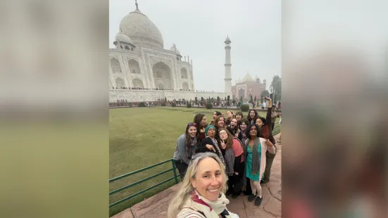 A group of St. Kate's students and faculty pose in front of the Taj Mahal