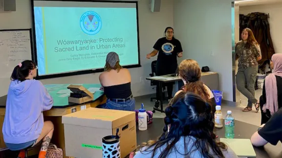 Jen Grey Eagle (pictured speaking) and Gabby Menomin (far right) speaking to the Algal Ecology class.