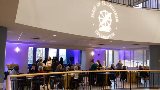 People mingle at the Feast of Saint Catherine reception in the CdC.