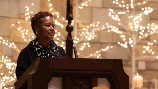 President Evans stands at a lectern in the Chapel.
