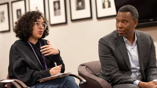 Ta-Nehisi Coates listens to a student speak.
