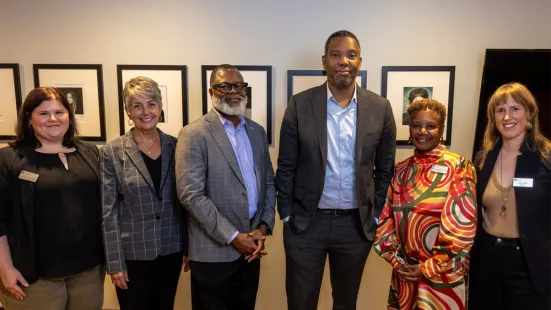 Ta-Nehisi Coates stands with Duchesne Drew, President Evans, and St. Kate's staff.