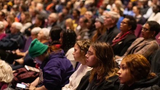 A packed audience sits in the O'Shaughnessy