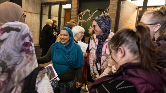 Najeeba Syeed, JD, in conversation with attendees in The O'Shaughnessy lobby