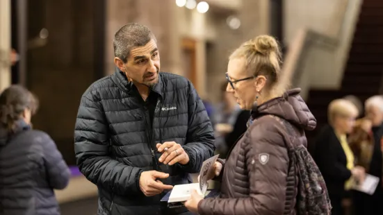 Jonathan Wilson-Hartgrove signs a book for an attendee